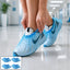 Blue disposable shoe covers with elastic fit for hygiene and protection.