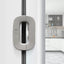 White fridge freezer door lock latch installed on refrigerator door for baby safety