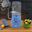 Portable electric juicer with handle and straw for fresh drinks.