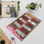 Durable stainless steel self-adhesive wall hook for kitchen organisation.