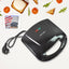 Dabster 2-slice sandwich maker with non-stick plates on a kitchen counter.