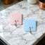 Self-adhesive wall utility hook with square base mounted on wall