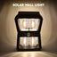 Solar Wall Lantern with motion sensor illuminating an outdoor space at dusk.