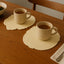 Elegant silicone leaf coaster set protecting a wooden table