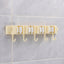 Self-adhesive broom and mop holder rack mounted on wall with utility hooks