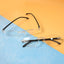 Close-up image of rimless reading glasses showcasing lightweight design and clear lenses
