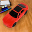 Audila Car Shape Wireless Speaker, showcasing its unique design and LED lights.