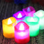 Vibrant multicolor LED tealight candles arranged for festive decoration.