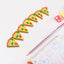 A set of seven colorful 3D pizza slice erasers arranged on a clean white surface.