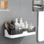 Wall mounted adhesive plastic storage shelf organized in bathroom