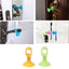Silicone door stopper attached to a door handle, protecting the wall.