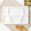 White plastic multi-compartment meal serving tray with 6 sections for portioned dining.