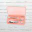 AuriGlam portable nail clipper set in its clear plastic travel case.
