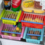 Close-up of an adjustable fridge storage basket showing its smart-slide design.