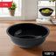 Black plastic serving bowl filled with curry showing deep design