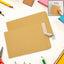 Brown Kraft Envelopes, 16x14 inches, stacked neatly on a wooden surface.