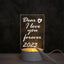 LED Acrylic Message Board Night Lamp glowing with handwritten message in a cozy room