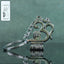 Om Shivling metal keychain showing front view and spiritual design