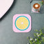 Heat-resistant silicone lemon drink coaster on wooden table