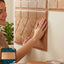 3D self-adhesive wallpaper applied in living room with geometric design