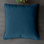 Soft decorative pillow covers in a living room setting.