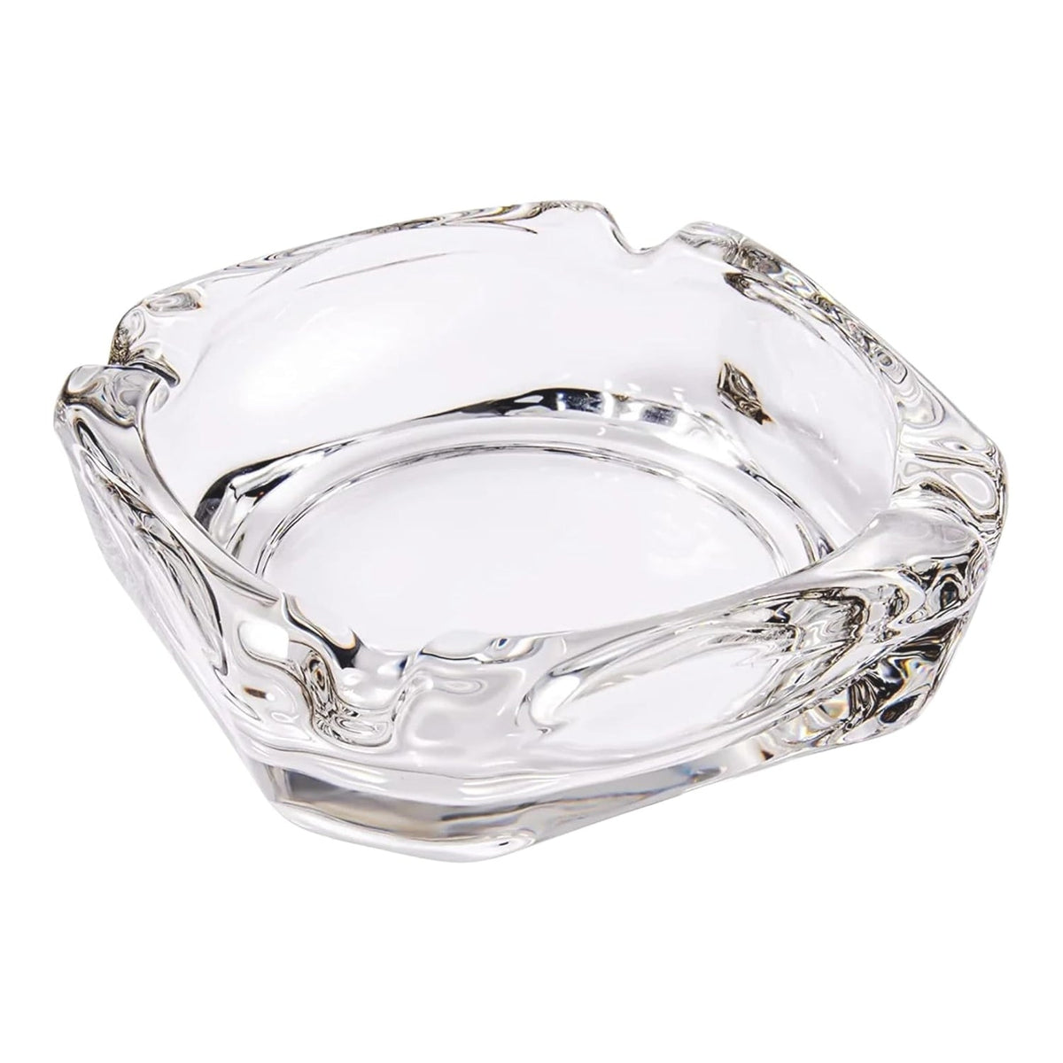 Elegant crystal glass ashtray with four cigar slots on a modern wooden table. Main image