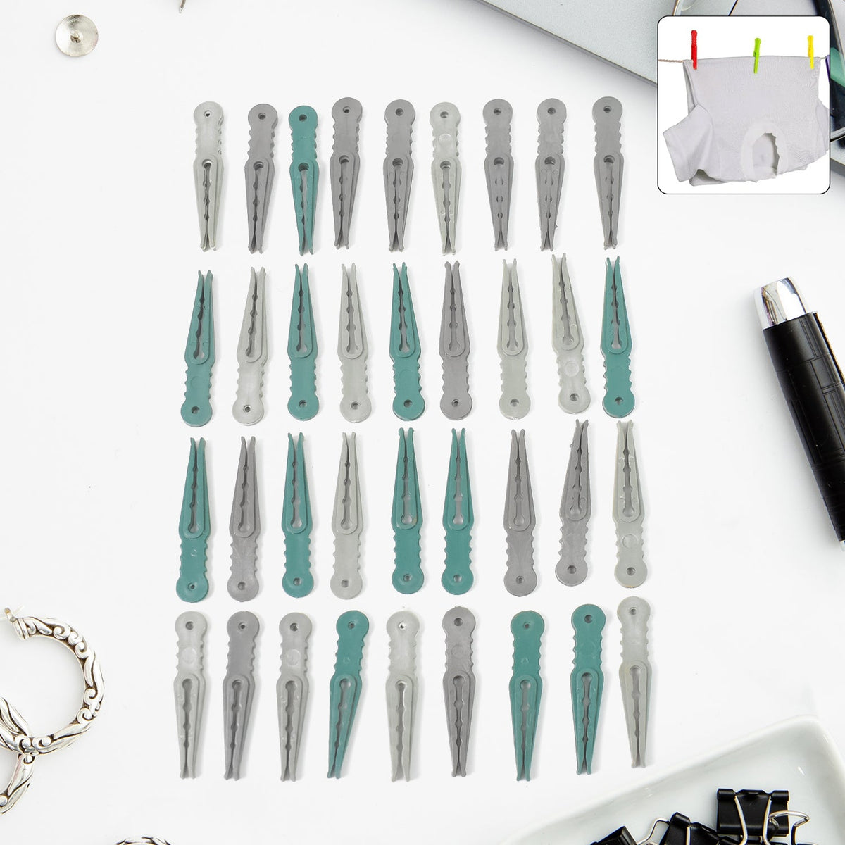 A set of 36 colourful plastic cloth pegs in a clear plastic basket, ready for laundry. Main image