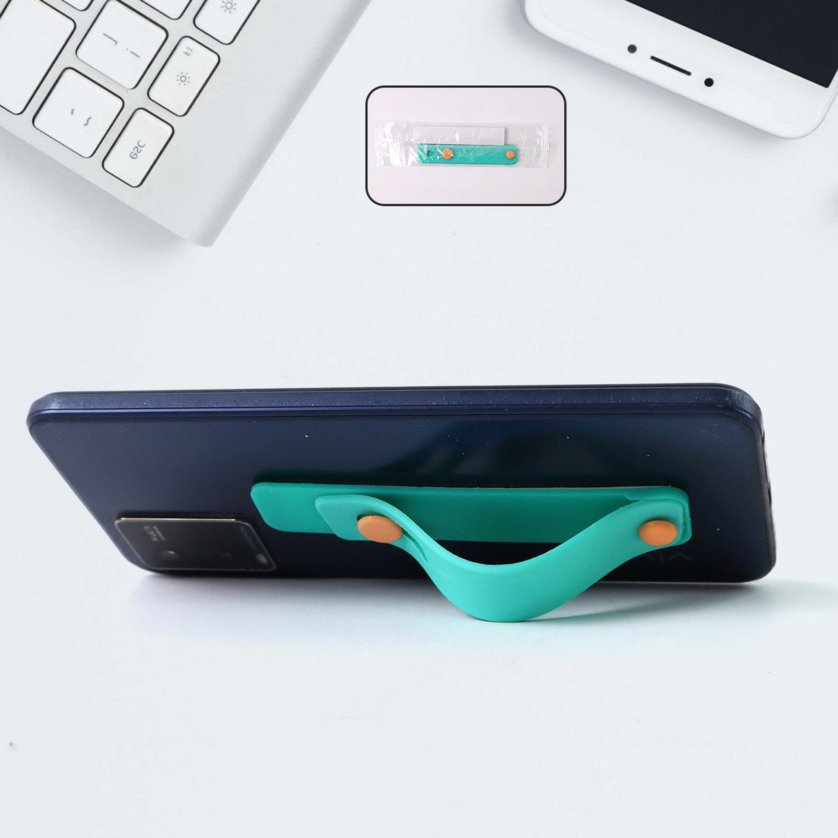 Teal Green phone loop finger holder secured on smartphone Main image