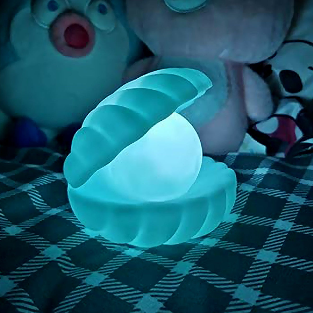 A glowing Pearl Shell Night Lamp on a light-colored surface, showcasing its unique design. Main image