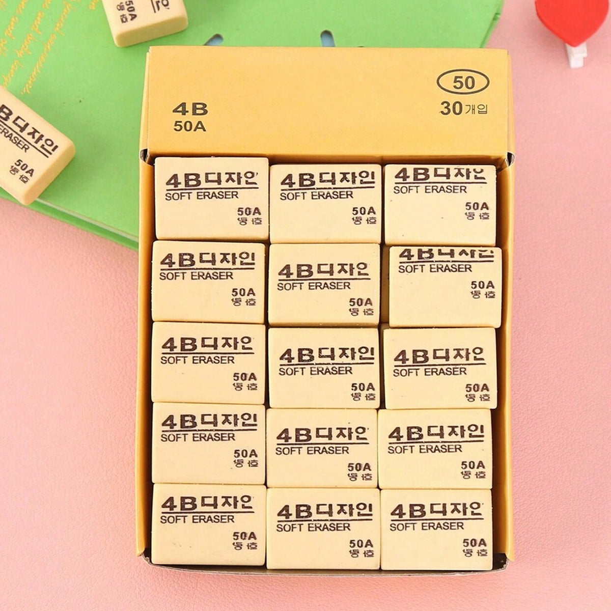 Thirty bright yellow 4B erasers neatly packaged for students and office use. Main image