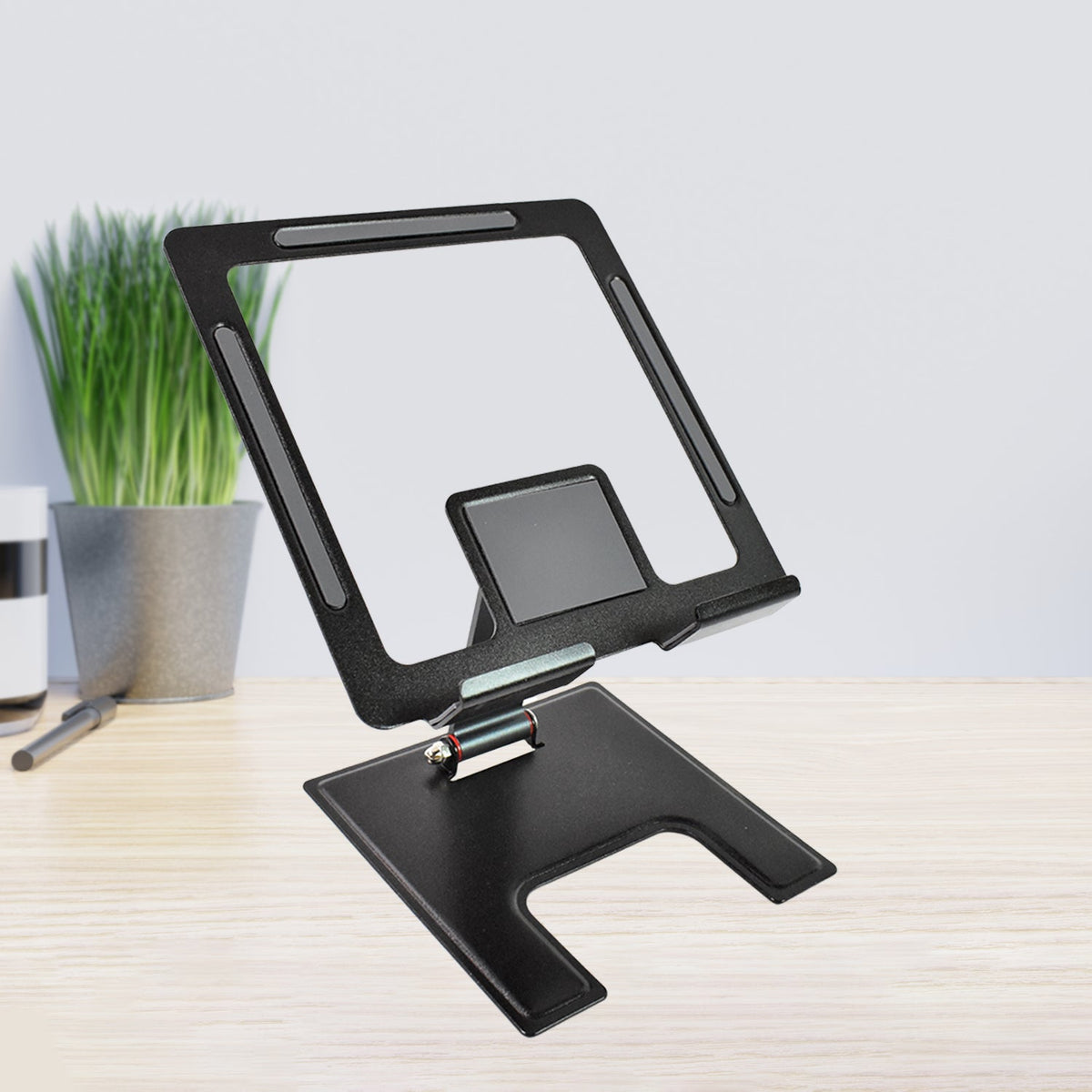 Sleek aluminium adjustable phone stand supporting a smartphone for hands-free viewing. Main image