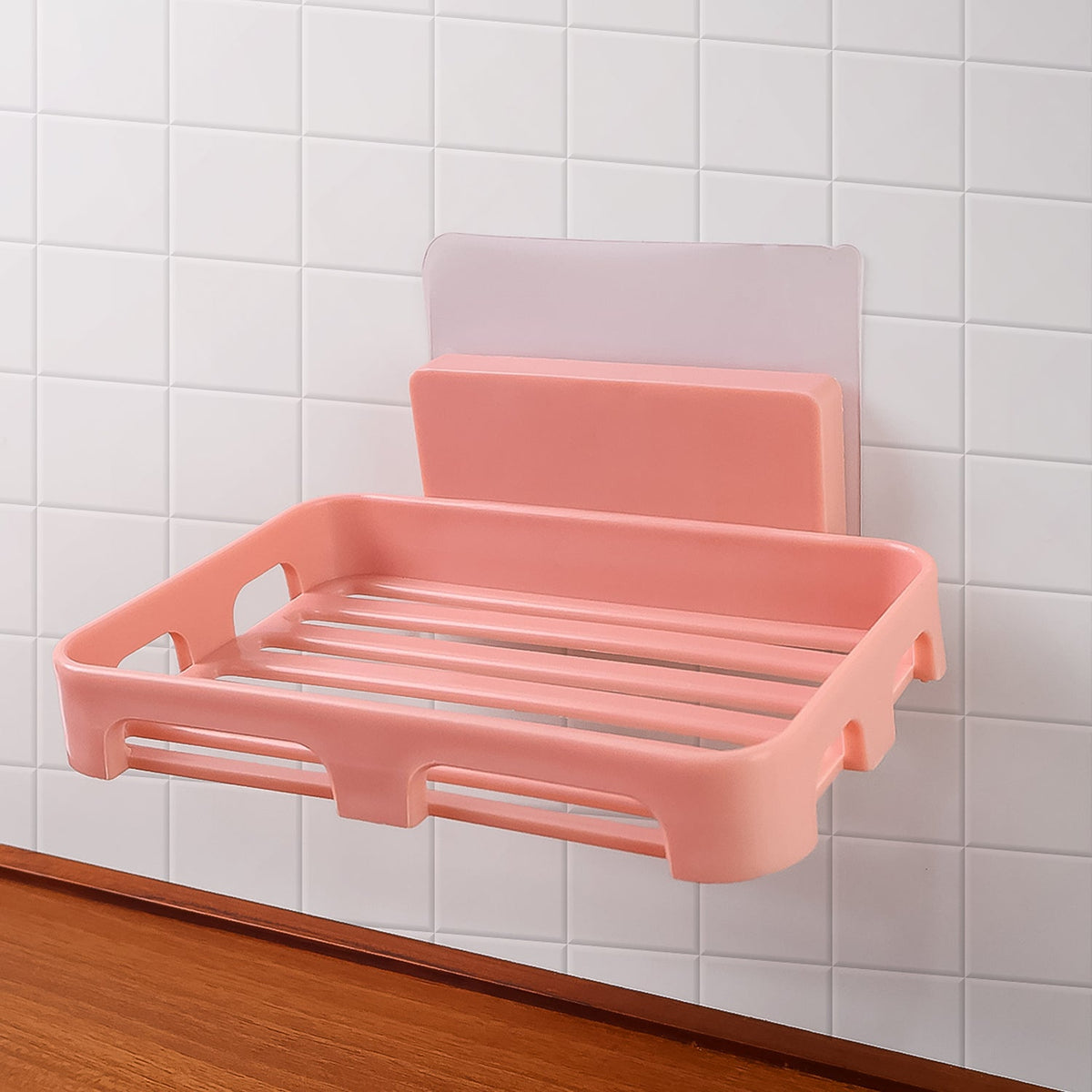 Self adhesive soap dish holder with open slatted design mounted on wall Main image
