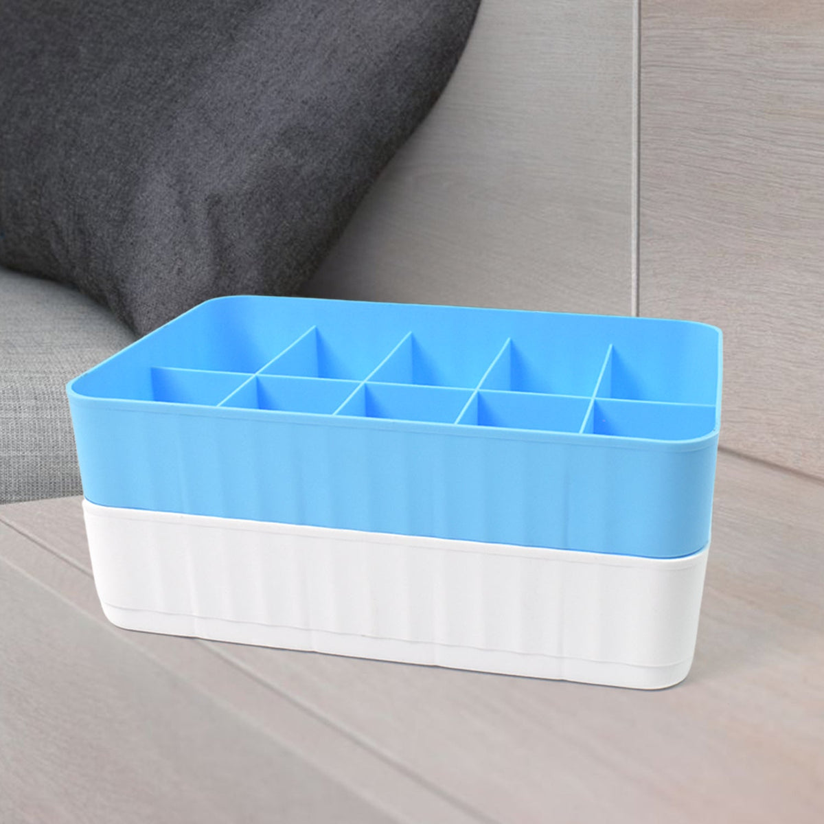 Two 10-grid drawer organiser boxes neatly storing socks and underwear inside a drawer. Main image