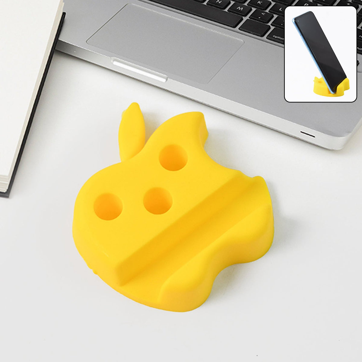 Apple-shaped plastic mobile stand with pen holder on desk supporting a smartphone Main image