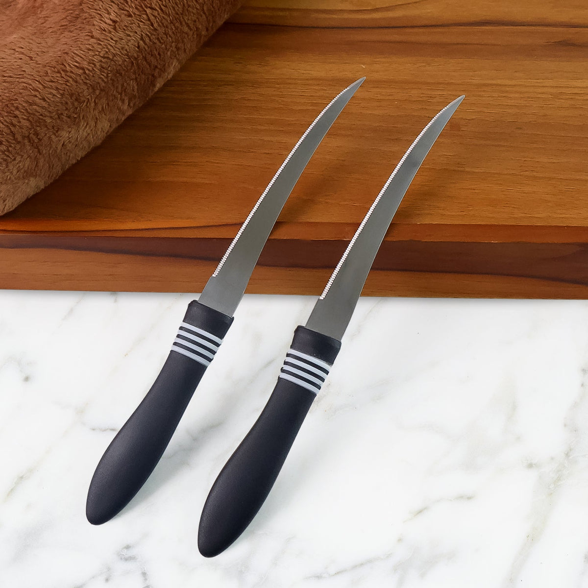 Serrated kitchen knife set with curved stainless steel blades on display Main image