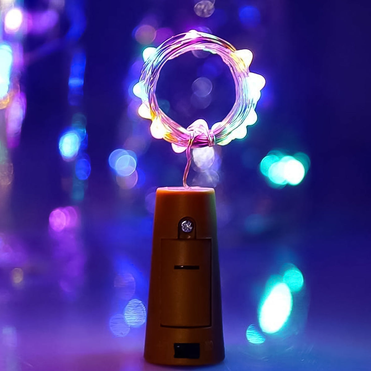 A multi-color LED bottle cork light illuminating an empty wine bottle, creating a festive glow. Main image