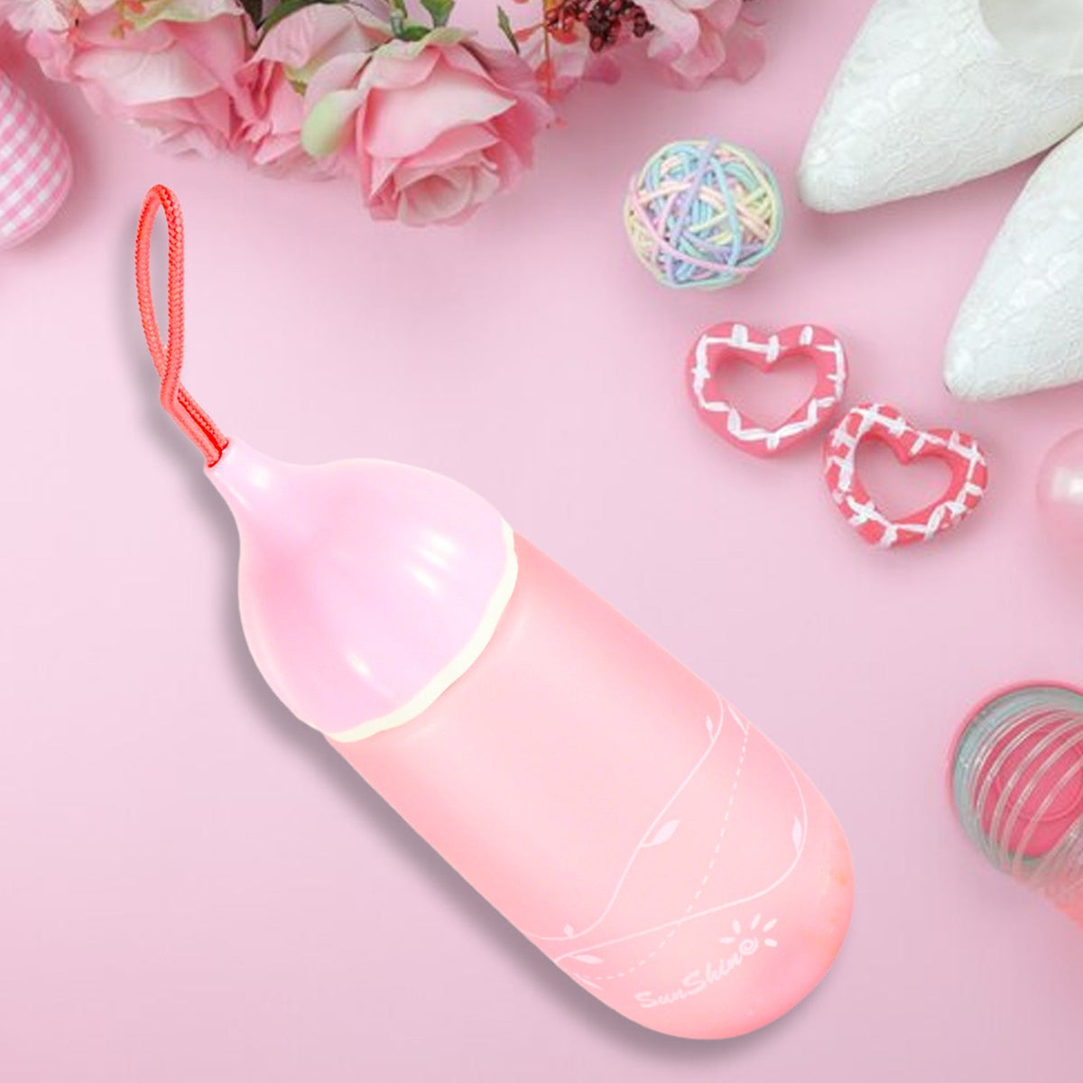 Front view of the unique shape plastic water bottle with a convenient carrying dori. Main image