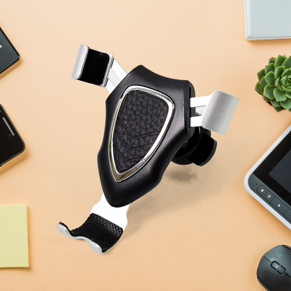 Gravity Car Phone Mount securely holding a smartphone on a dashboard. Main image