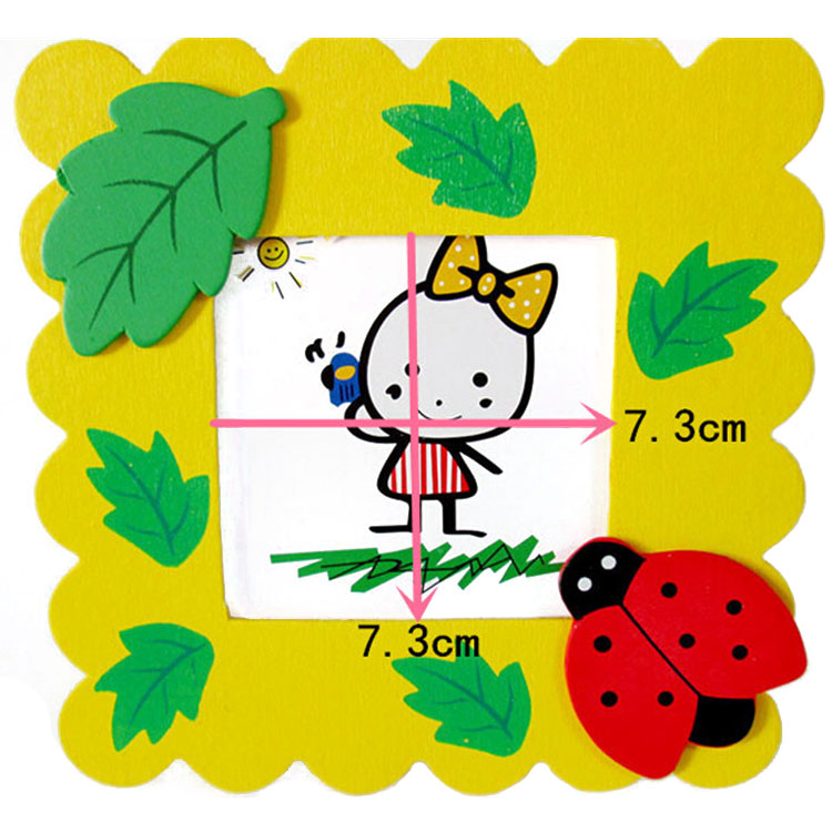 Close-up of a cute elephant design baby photo frame on a wooden table. Main image