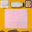 200-piece multi-color oil-absorbing baking paper sheets with scalloped edges on tray