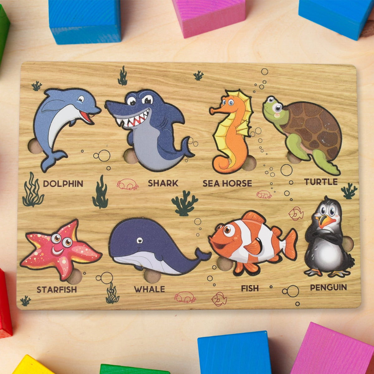 Wooden Sea Animal Puzzle board with vibrant ocean creatures for toddlers. Main image