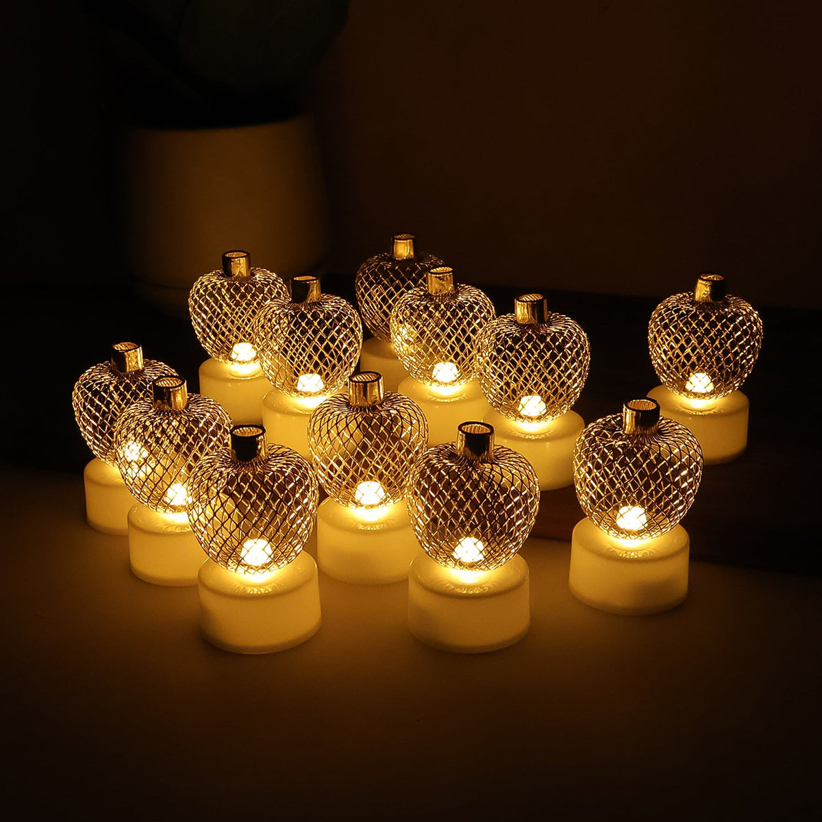 Set of 12 apple shape LED tealight candles with golden mesh cover Main image