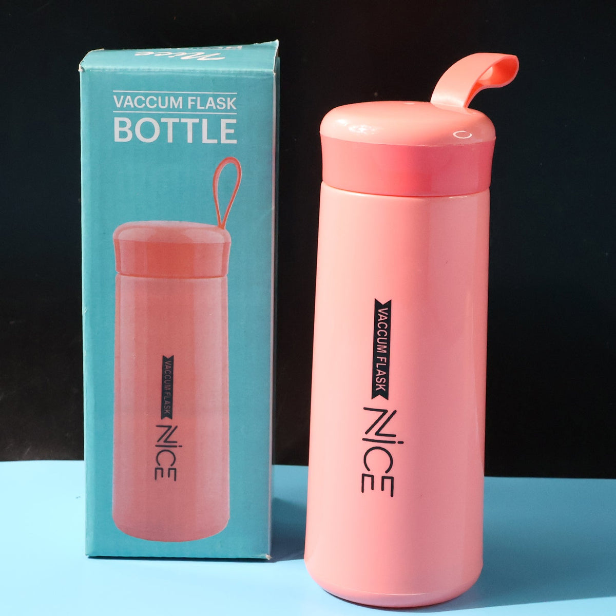 Pink plastic water bottle with carry strap and leak-proof lid Main image