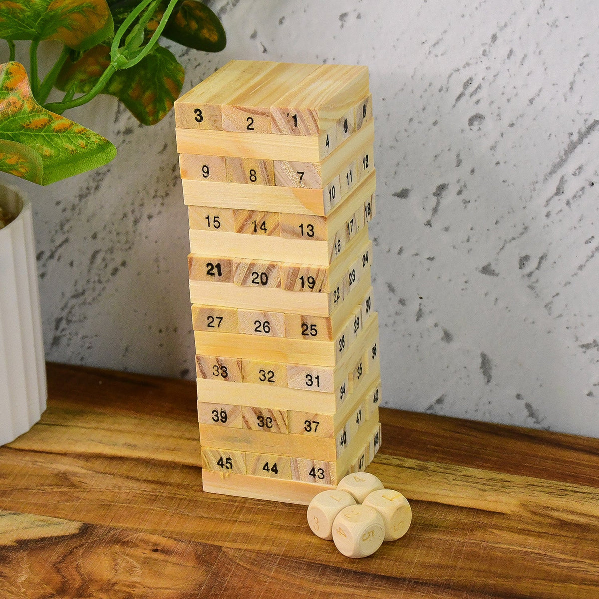 A tall tower of natural wooden blocks with dice, ready for a challenging Wooden Stacking Game. Main image