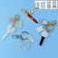 Acrylic and metal keychain featuring a microphone design
