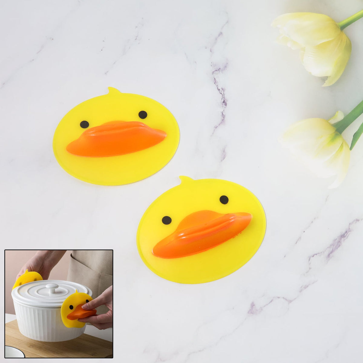 Duck silicone hot pot holder lifting a hot pot lid with secure grip Main image