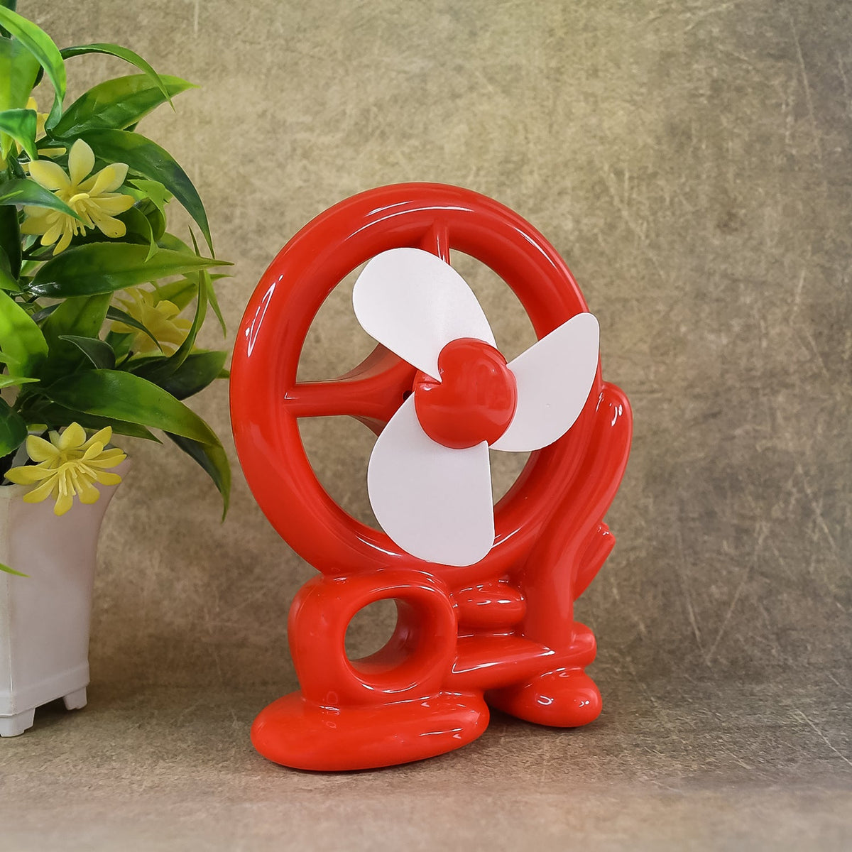 Red Mini Cooling USB Fan on a desk, ready for personal use. Main image