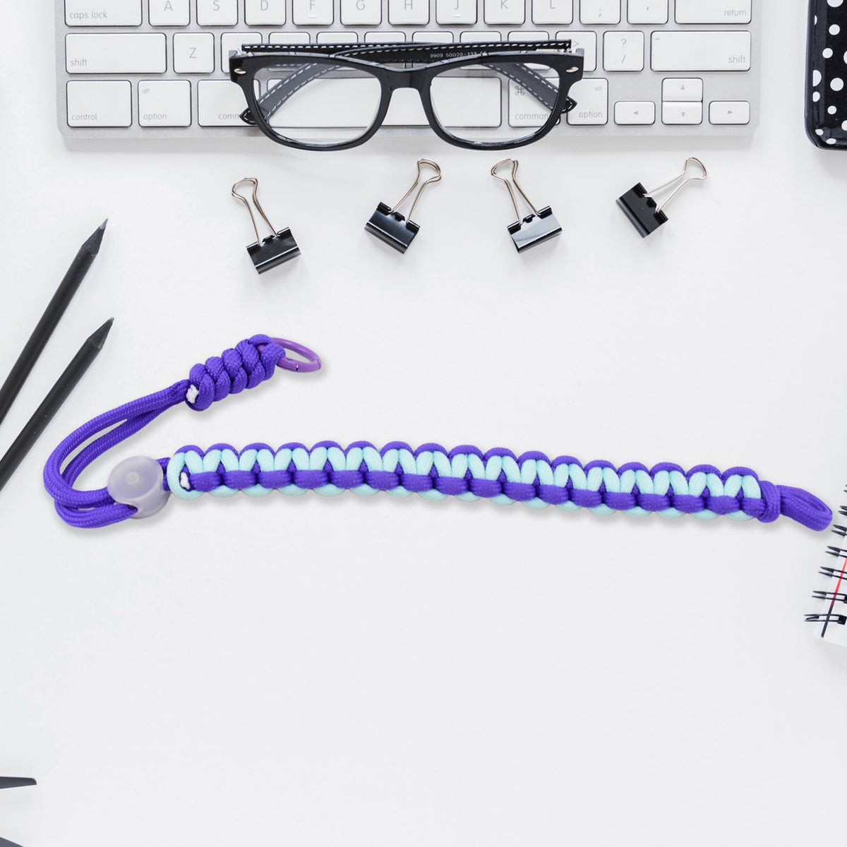 Multicolor adjustable phone wrist strap lanyard displayed on a clean surface. Main image
