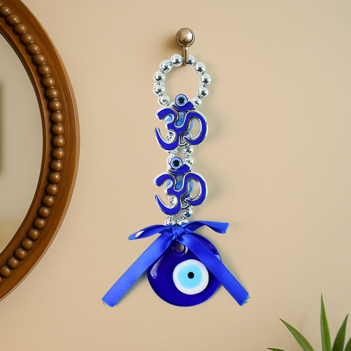 Double OM Evil Eye hanging with blue Nazar disc and silver beads Main image
