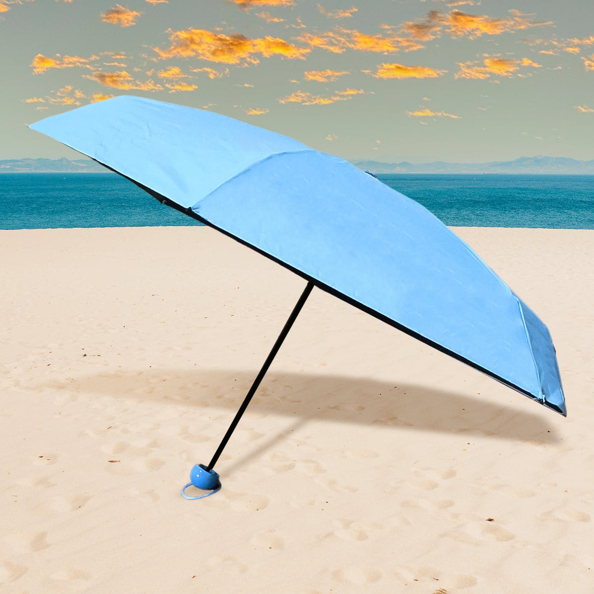 A sleek, black 5-Fold Umbrella neatly stored in its matching capsule case, ready for travel. Main image